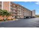Three-story condo building with parking and landscaping at 8174 Terrace Garden N Dr # 110, St Petersburg, FL 33709