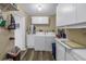 Laundry room with washer, dryer, and cabinets at 8174 Terrace Garden N Dr # 110, St Petersburg, FL 33709