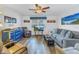 Living room with comfy seating and wood-look floors at 8174 Terrace Garden N Dr # 110, St Petersburg, FL 33709