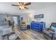 Living room, dining area, and wood-look floors at 8174 Terrace Garden N Dr # 110, St Petersburg, FL 33709