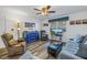 Living room with comfy seating and wood-look floors at 8174 Terrace Garden N Dr # 110, St Petersburg, FL 33709
