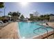 Community pool area with lounge chairs and tennis courts visible at 8174 Terrace Garden N Dr # 110, St Petersburg, FL 33709