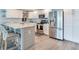 Modern kitchen with white cabinets, stainless steel appliances and marble countertops at 855 Bayway Blvd # 606, Clearwater, FL 33767