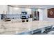 Modern kitchen with stainless steel appliances and marble countertops at 855 Bayway Blvd # 606, Clearwater, FL 33767