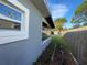 Side yard with shed and wooden fence at 9018 1St N St, St Petersburg, FL 33702