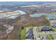 Aerial view showcasing a tranquil neighborhood near lakes and wetlands at 10374 Echo Dock Loop, San Antonio, FL 33576