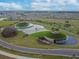 Expansive community entrance with multiple fountains and landscaping at 10374 Echo Dock Loop, San Antonio, FL 33576