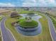 Community entrance with circular fountain and gazebo at 10374 Echo Dock Loop, San Antonio, FL 33576