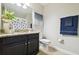 Clean bathroom with granite countertop, dark vanity, and a shower/tub combo at 10374 Echo Dock Loop, San Antonio, FL 33576