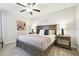 Main bedroom with ceiling fan and large bed at 10374 Echo Dock Loop, San Antonio, FL 33576