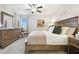 Spacious Primary bedroom with large bed and dresser at 10374 Echo Dock Loop, San Antonio, FL 33576