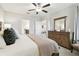 Main bedroom with dresser and ensuite bathroom at 10374 Echo Dock Loop, San Antonio, FL 33576