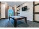 Relaxing billiards room with pool table and brick feature wall at 10374 Echo Dock Loop, San Antonio, FL 33576