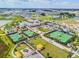 Aerial view of community amenities including tennis courts, a playground, and pool at 10374 Echo Dock Loop, San Antonio, FL 33576