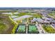 Aerial view of community amenities including tennis courts, pickleball, and pool at 10374 Echo Dock Loop, San Antonio, FL 33576