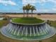 Large circular fountain is the centerpiece of community entrance at 10374 Echo Dock Loop, San Antonio, FL 33576
