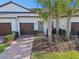 Inviting exterior with a two-car garage and landscaped entrance at 10374 Echo Dock Loop, San Antonio, FL 33576