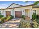 Two-unit home with two-car garages and landscaping at 10374 Echo Dock Loop, San Antonio, FL 33576