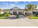 Front view of two-unit home with two-car garages at 10374 Echo Dock Loop, San Antonio, FL 33576