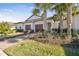 Three-unit home with two-car garages and palm trees at 10374 Echo Dock Loop, San Antonio, FL 33576