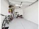 Garage with ample space for vehicles, storage, and bicycles at 10374 Echo Dock Loop, San Antonio, FL 33576