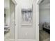 Hallway with neutral walls and modern artwork at 10374 Echo Dock Loop, San Antonio, FL 33576