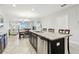 Kitchen island with granite countertops and stainless steel appliances at 10374 Echo Dock Loop, San Antonio, FL 33576