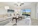 Relaxing living room featuring a neutral color palette, comfy seating, and sliding glass doors at 10374 Echo Dock Loop, San Antonio, FL 33576