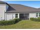 Screened patio with seating area and lush landscaping at 10374 Echo Dock Loop, San Antonio, FL 33576