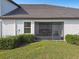 Relaxing screened patio with seating area, perfect for outdoor enjoyment at 10374 Echo Dock Loop, San Antonio, FL 33576