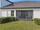 Cozy screened patio with a table and chairs at 10374 Echo Dock Loop, San Antonio, FL 33576