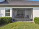 Enjoy outdoor dining in this screened patio, complete with table and chairs at 10374 Echo Dock Loop, San Antonio, FL 33576