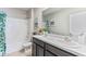 Clean bathroom with double vanity and floral shower curtain at 10558 Dusty Boot Rd, Land O Lakes, FL 34638