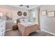Charming bedroom with pink and white decor at 10558 Dusty Boot Rd, Land O Lakes, FL 34638
