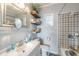 Clean bathroom with a floating vanity and patterned tile shower at 14045 21St St, Dade City, FL 33525