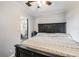 Bright bedroom with dark wood furniture and patterned bedding at 14045 21St St, Dade City, FL 33525