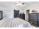 Serene bedroom with dark wood furniture and patterned bedding at 14045 21St St, Dade City, FL 33525
