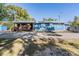 Blue house with covered patio and large backyard at 14045 21St St, Dade City, FL 33525