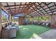 Covered outdoor gym with artificial turf and barn doors at 14045 21St St, Dade City, FL 33525
