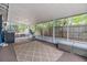 Relaxing screened porch with seating and ample outdoor space at 14045 21St St, Dade City, FL 33525