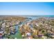 Wide aerial showcasing waterfront homes and the Gulf of Mexico at 1575 Brookside Blvd, Largo, FL 33770