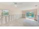 Bright bedroom with a window and sliding glass door that leads to the pool at 1575 Brookside Blvd, Largo, FL 33770