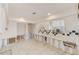 Bright kitchen with white cabinets, tile flooring, and black and white backsplash accents at 1575 Brookside Blvd, Largo, FL 33770