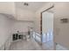 Functional laundry room with cabinets and tiled flooring, ready for your personal touch at 1575 Brookside Blvd, Largo, FL 33770