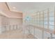 Open living space featuring glass block details, ready to be updated with your personal style at 1575 Brookside Blvd, Largo, FL 33770