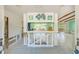 Open living room featuring a large aquarium, decorative fish art, and tile flooring at 1575 Brookside Blvd, Largo, FL 33770