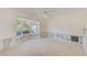 Sunlit room with a large bay window, awaiting your personal touch for renovation at 1575 Brookside Blvd, Largo, FL 33770