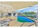 Enclosed pool and patio area with seating and canal view at 1575 Brookside Blvd, Largo, FL 33770