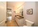 Bathroom with granite vanity and large mirror at 17546 Fairmeadow Dr, Tampa, FL 33647