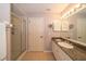 Bathroom with shower and granite vanity at 17546 Fairmeadow Dr, Tampa, FL 33647